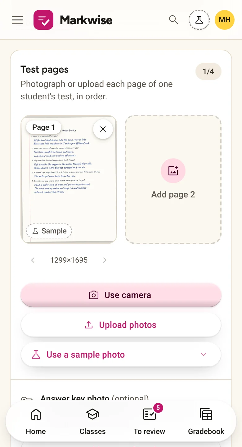 The Paper Scanner on a phone: a photo of a handwritten quiz added as page 1, with buttons to use the camera or upload more pages.